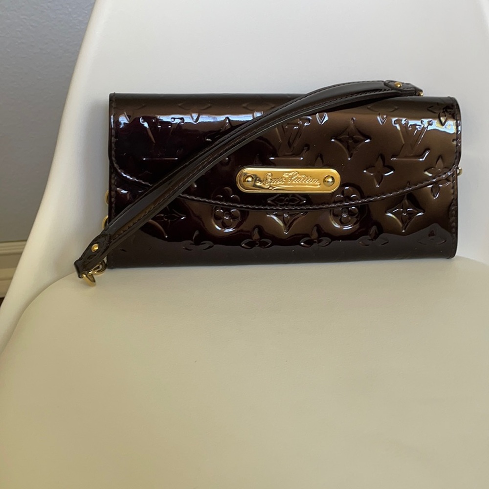 Genuine Louis Vuitton.   Dark burgundy color. gold color hardware